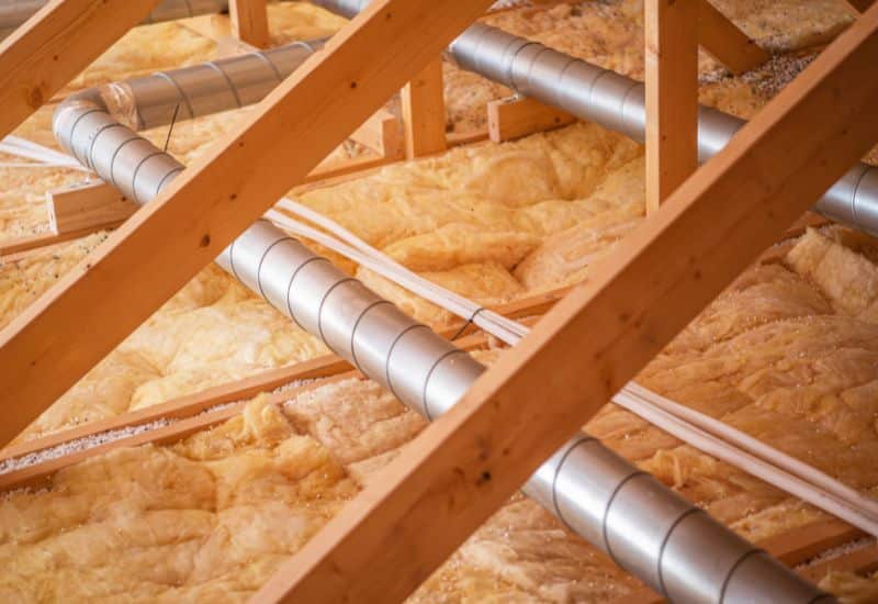Attic insulation installation around ductwork in Phoenix AZ