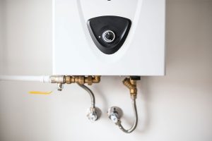 Wall-mounted tankless water heater installed in Phoenix AZ